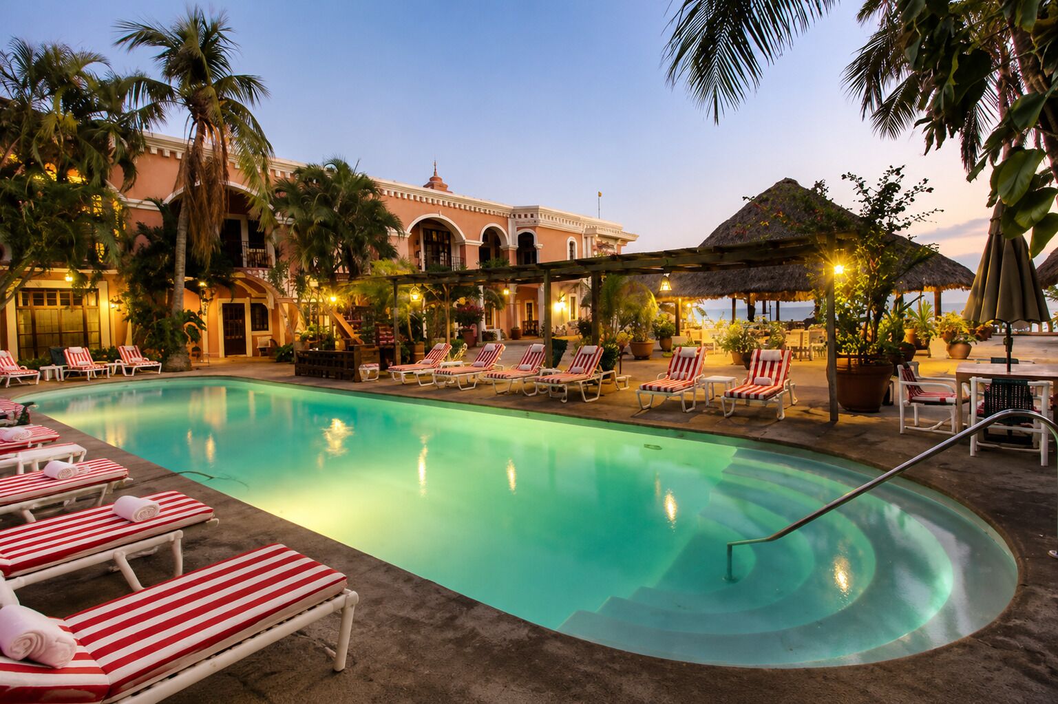 3 outdoor pools, open 7:00 AM to 9:00 PM, pool umbrellas