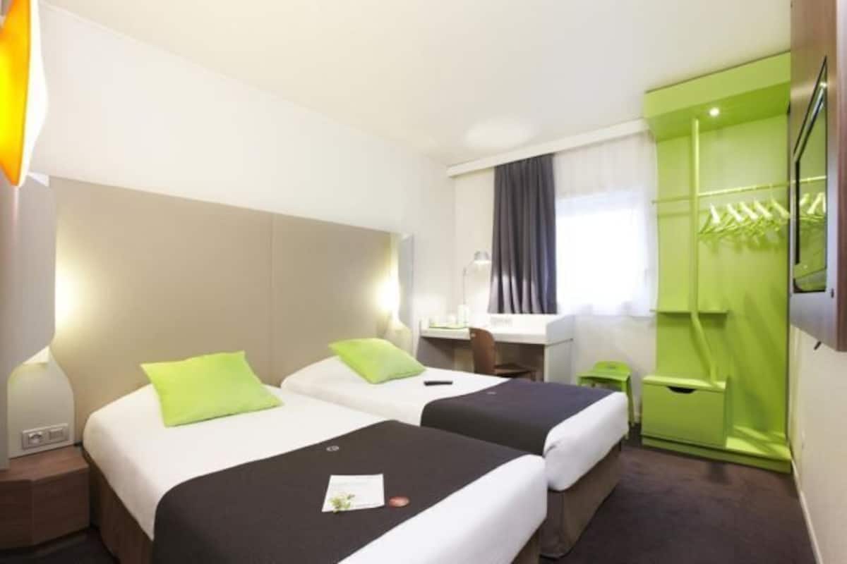 Premium bedding, desk, laptop workspace, blackout curtains