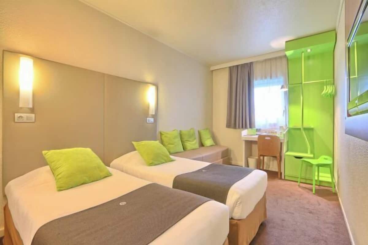 Premium bedding, desk, laptop workspace, blackout curtains