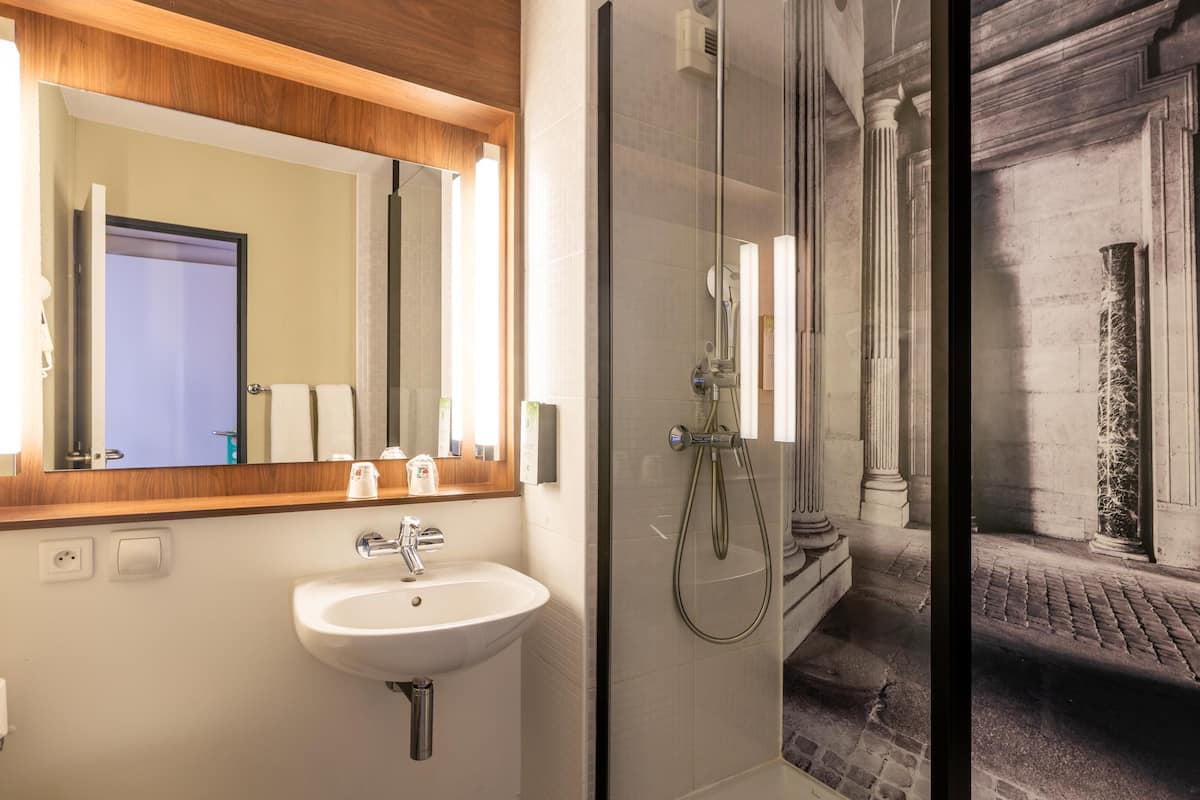 Premium bedding, desk, laptop workspace, blackout drapes