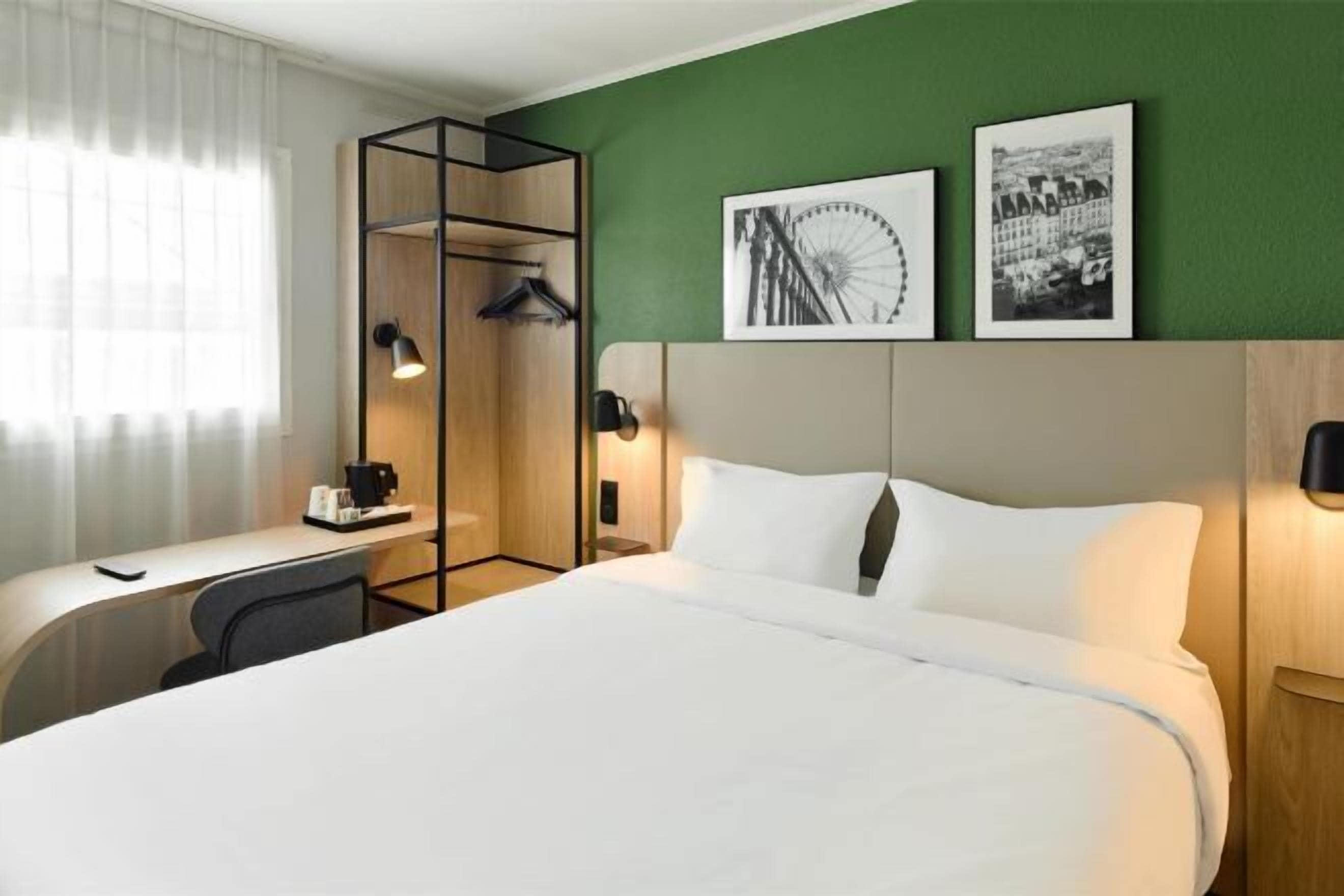 Premium bedding, desk, laptop workspace, blackout drapes