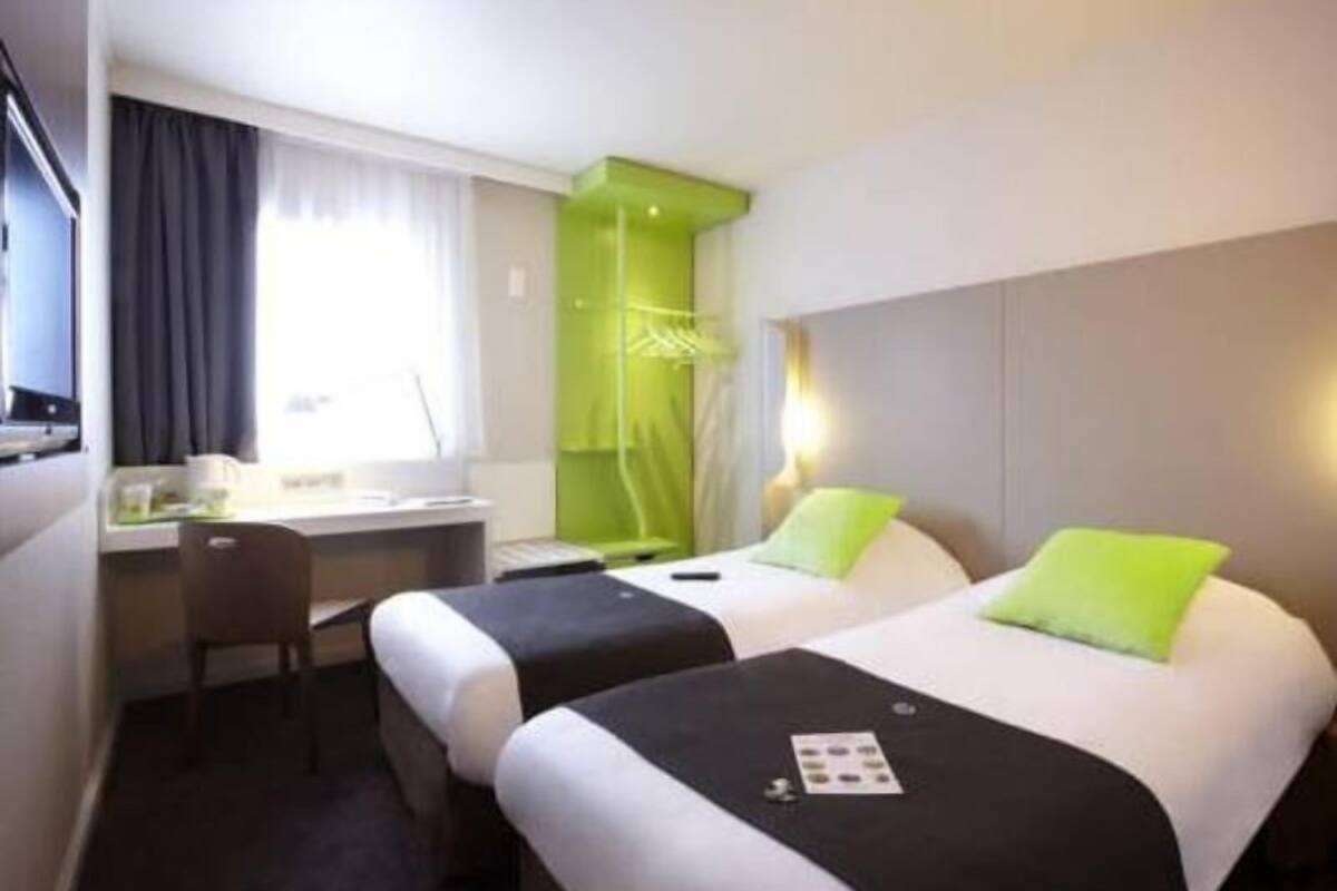 Premium bedding, desk, laptop workspace, blackout drapes