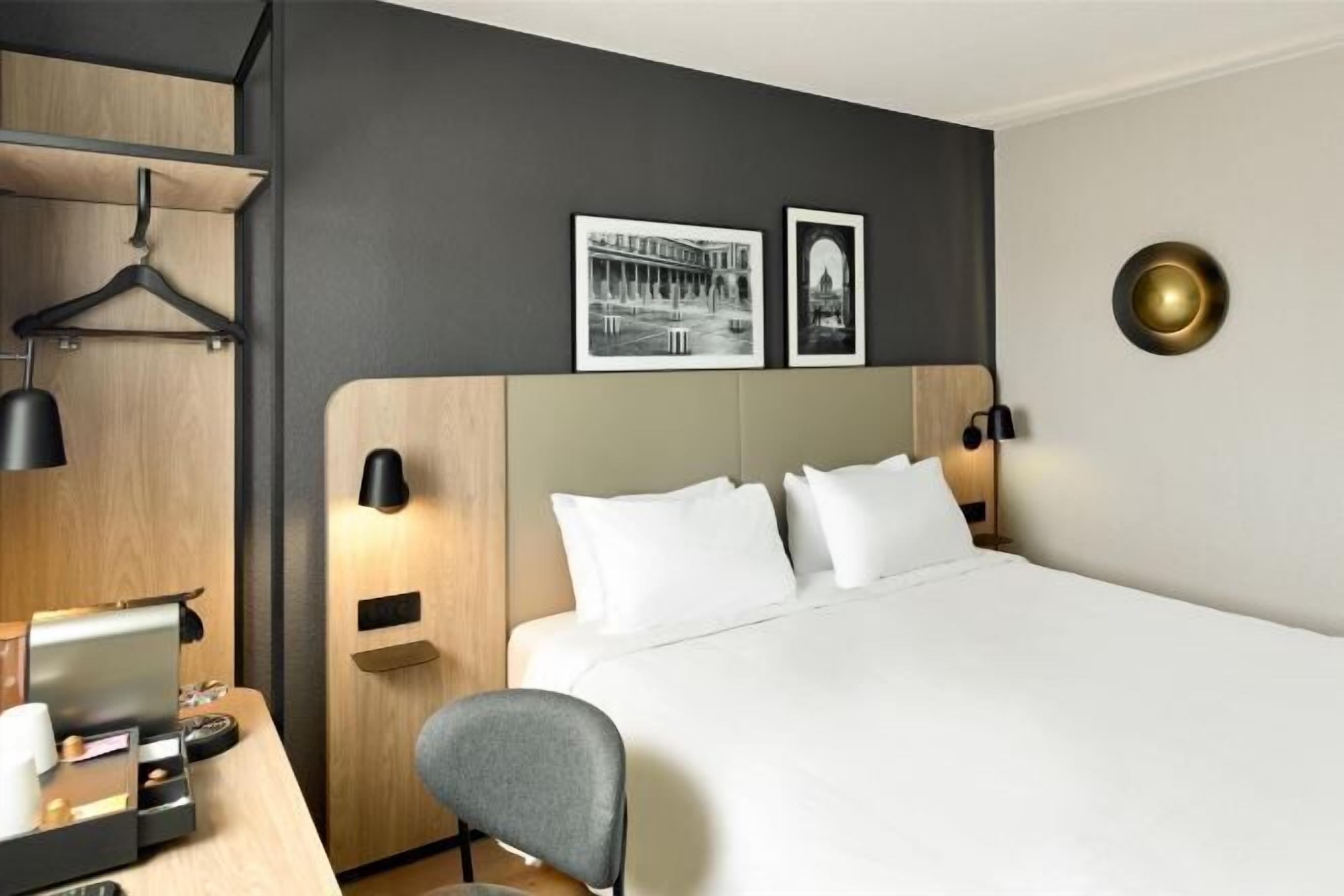 Premium bedding, desk, laptop workspace, blackout drapes