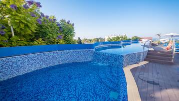 Indoor pool, 3 outdoor pools, open 9:00 AM to 7:00 PM, pool umbrellas