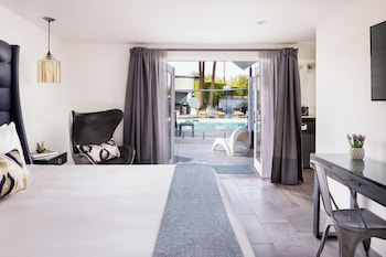 Deluxe Room, 1 King Bed, Pool View | Pillowtop beds, in-room safe, desk, blackout drapes at The Palm Springs Hotel