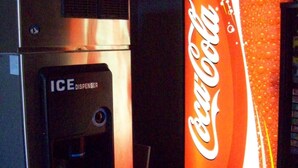 A vending machine with an ICE DISPENSER and a Coca-Cola machine. - Gateway Inn - Savannah (Savannah)