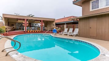 Outdoor pool, open 8:00 AM to 10 PM, pool loungers