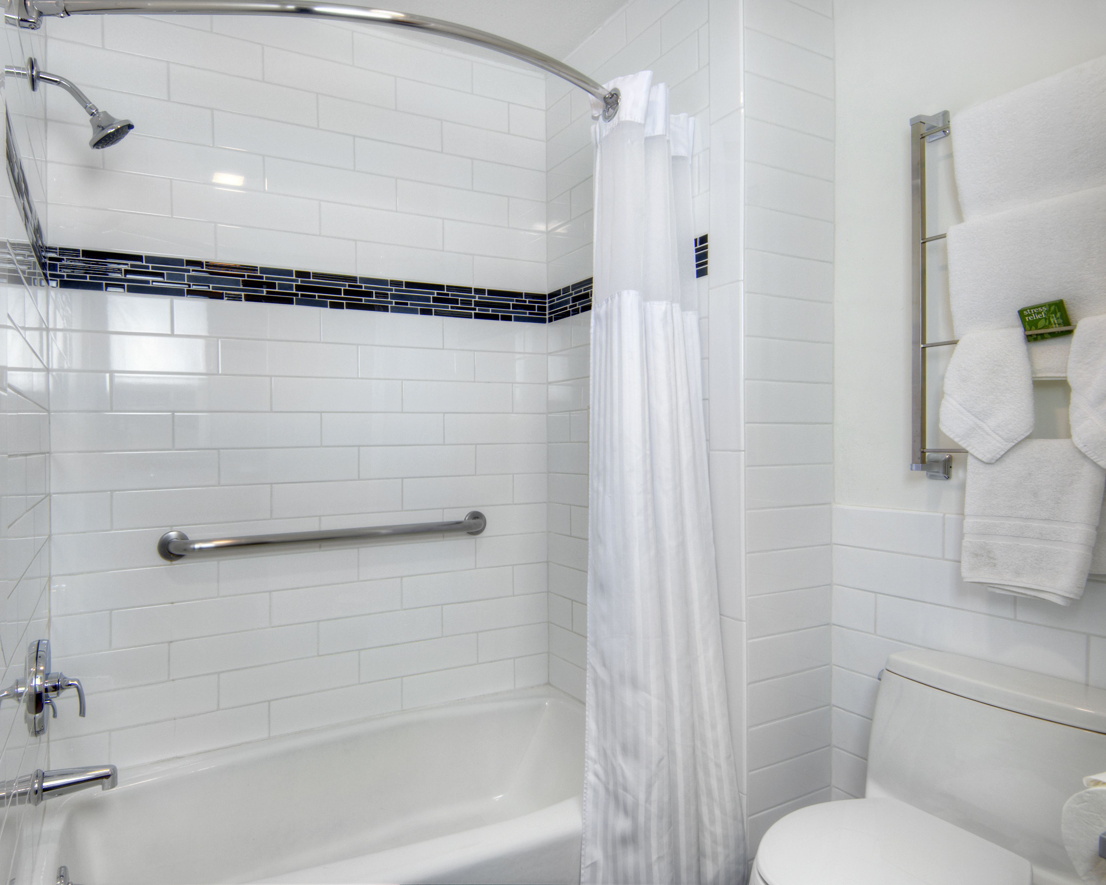 designer toiletries, hair dryer, towels, soap