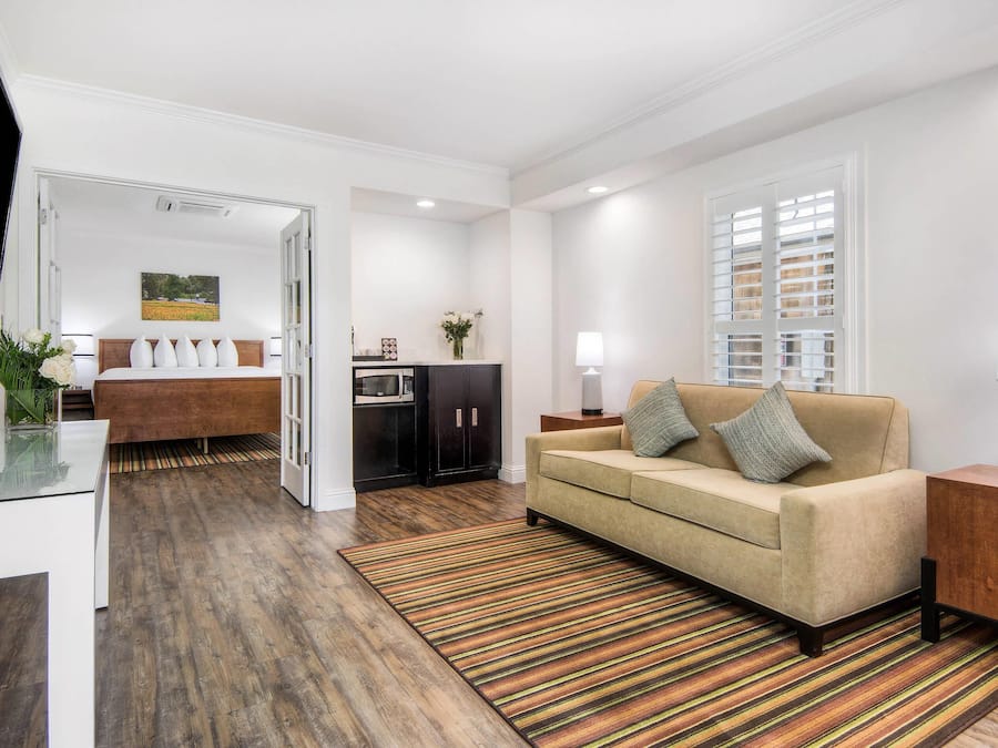 Suite, 1 King Bed with Sofa bed, Non Smoking (Cottage) | Pillow-top beds, desk, laptop workspace, iron/ironing board