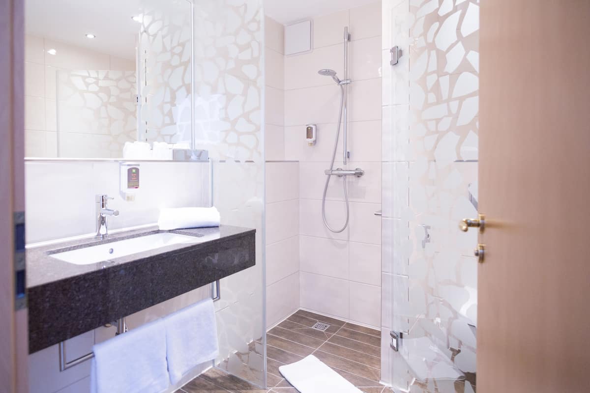 shower, eco-friendly toiletries, hair dryer, towels