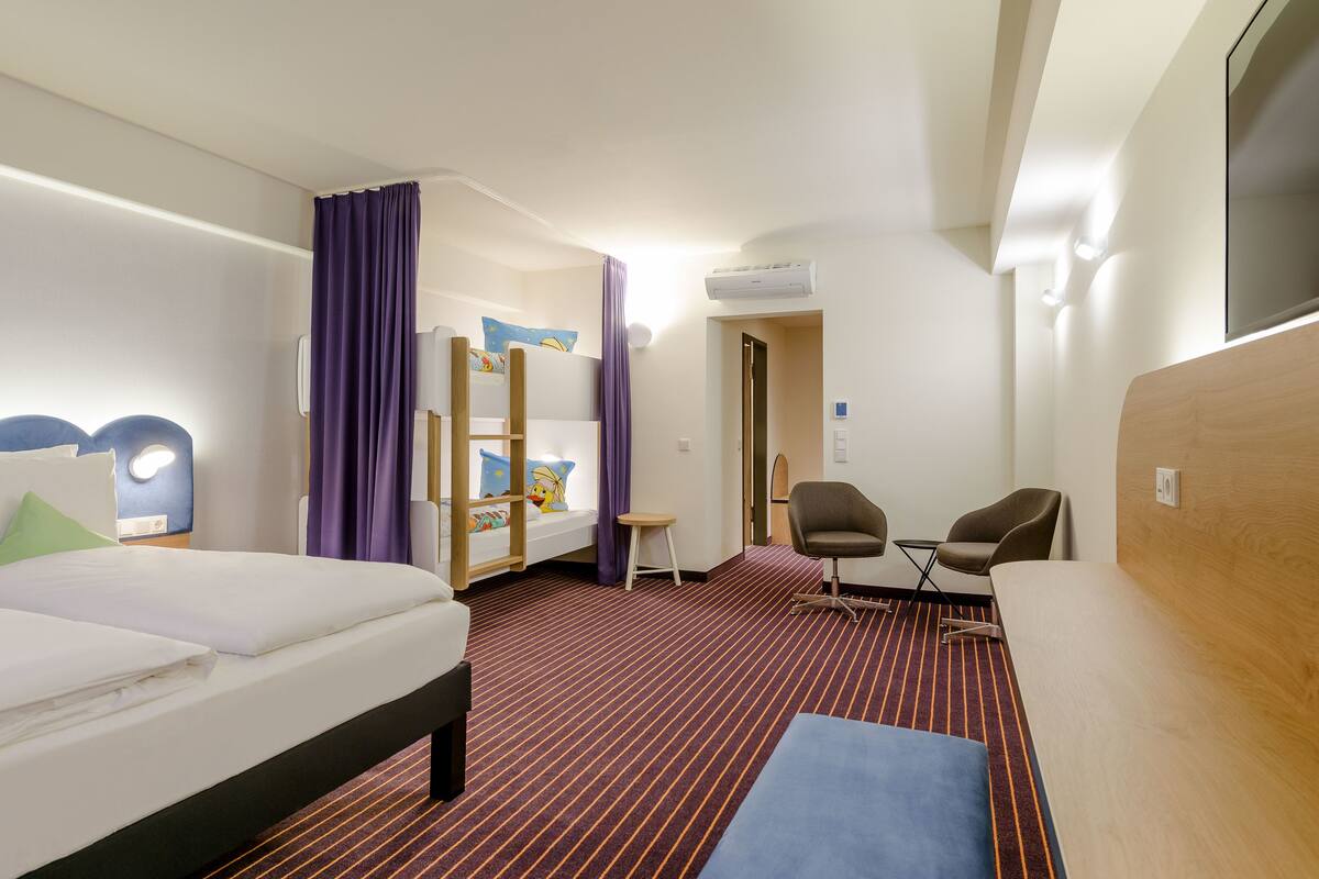 comfort twin room, multiple beds (all comfort) | living area | flat-screen tv