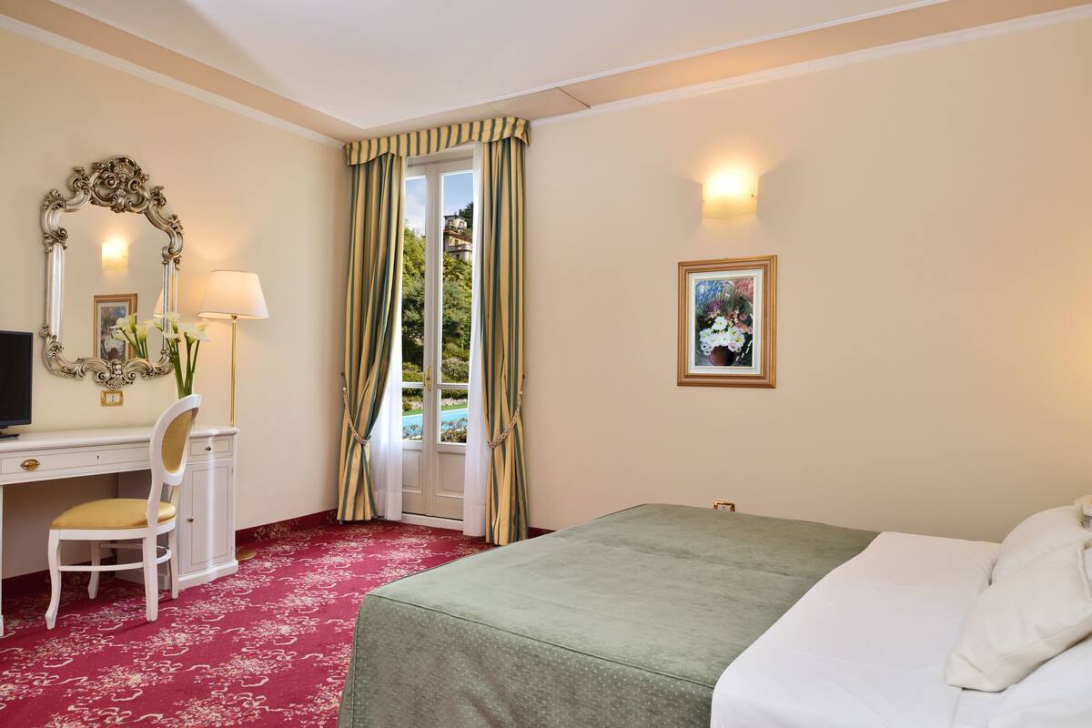 Standard Triple Room, Garden View | Minibar, desk, laptop workspace, soundproofing