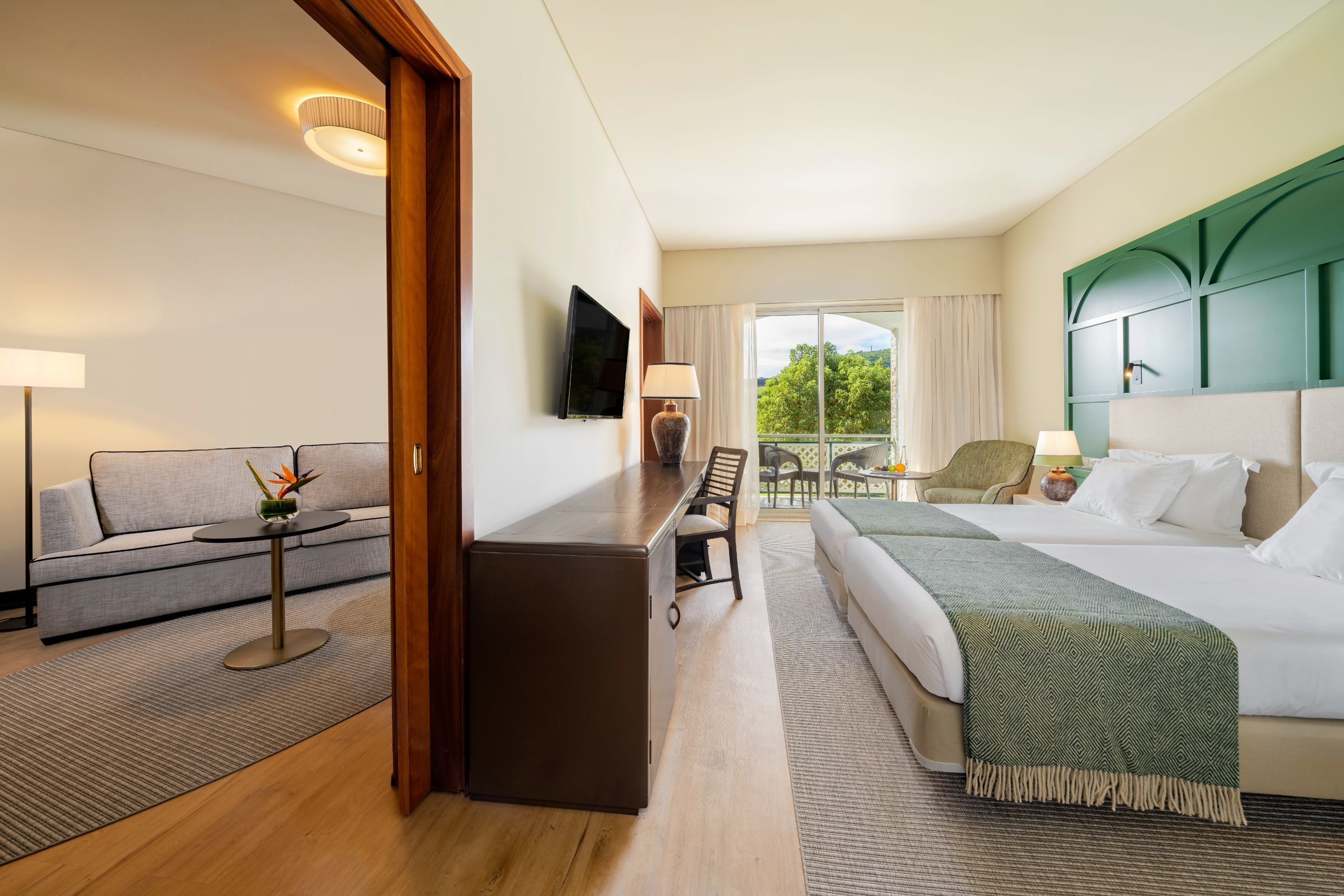 family triple room, ocean view | minibar, in-room safe, desk, blackout curtains