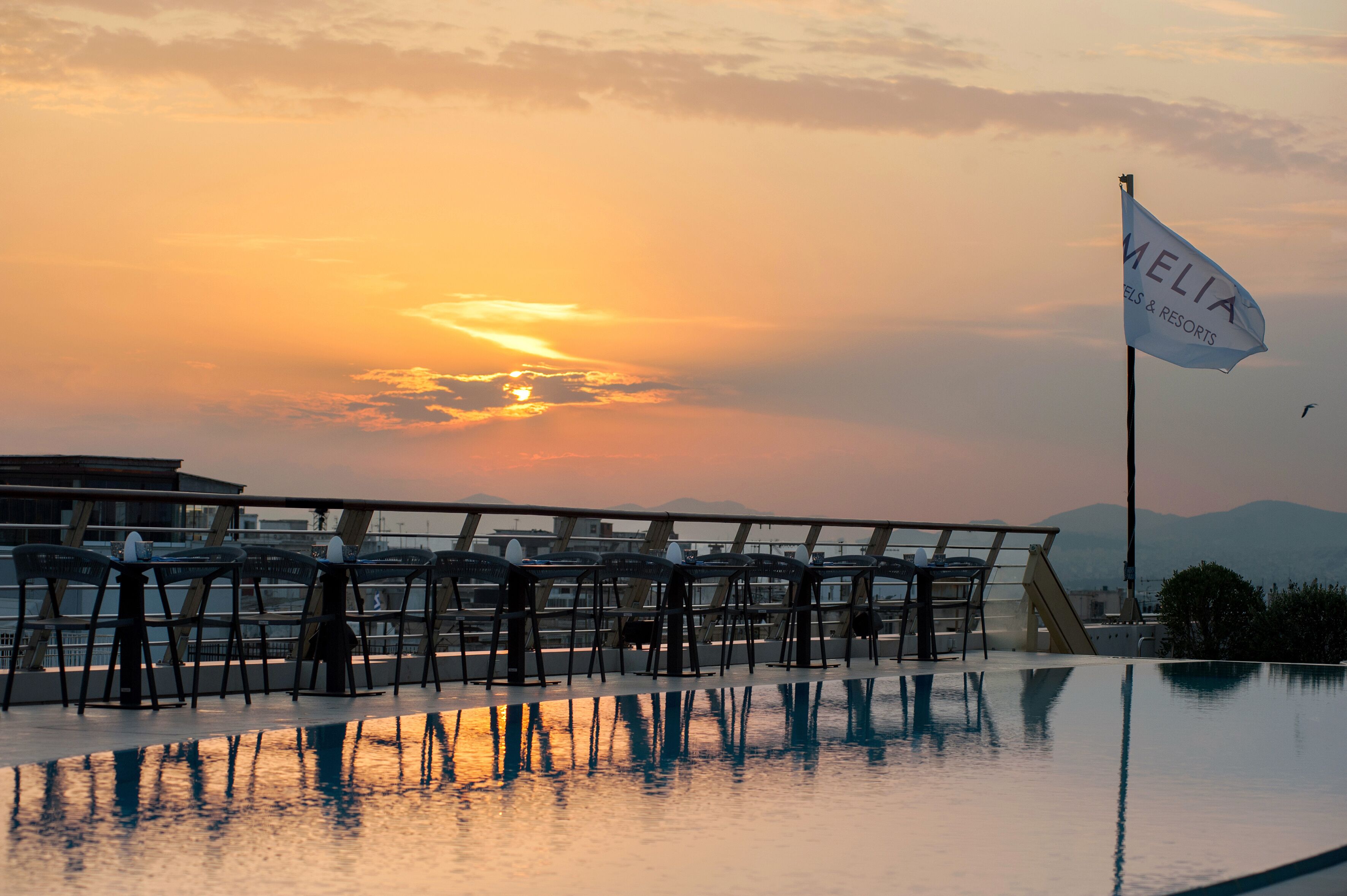 seasonal outdoor pool, open 10 am to 6 pm, pool umbrellas, pool loungers