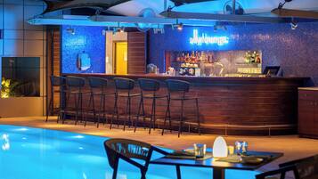 Seasonal outdoor pool, open 10 AM to 6 PM, pool umbrellas, pool loungers