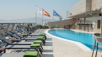 Seasonal outdoor pool, open 10 AM to 6 PM, pool umbrellas, sun loungers