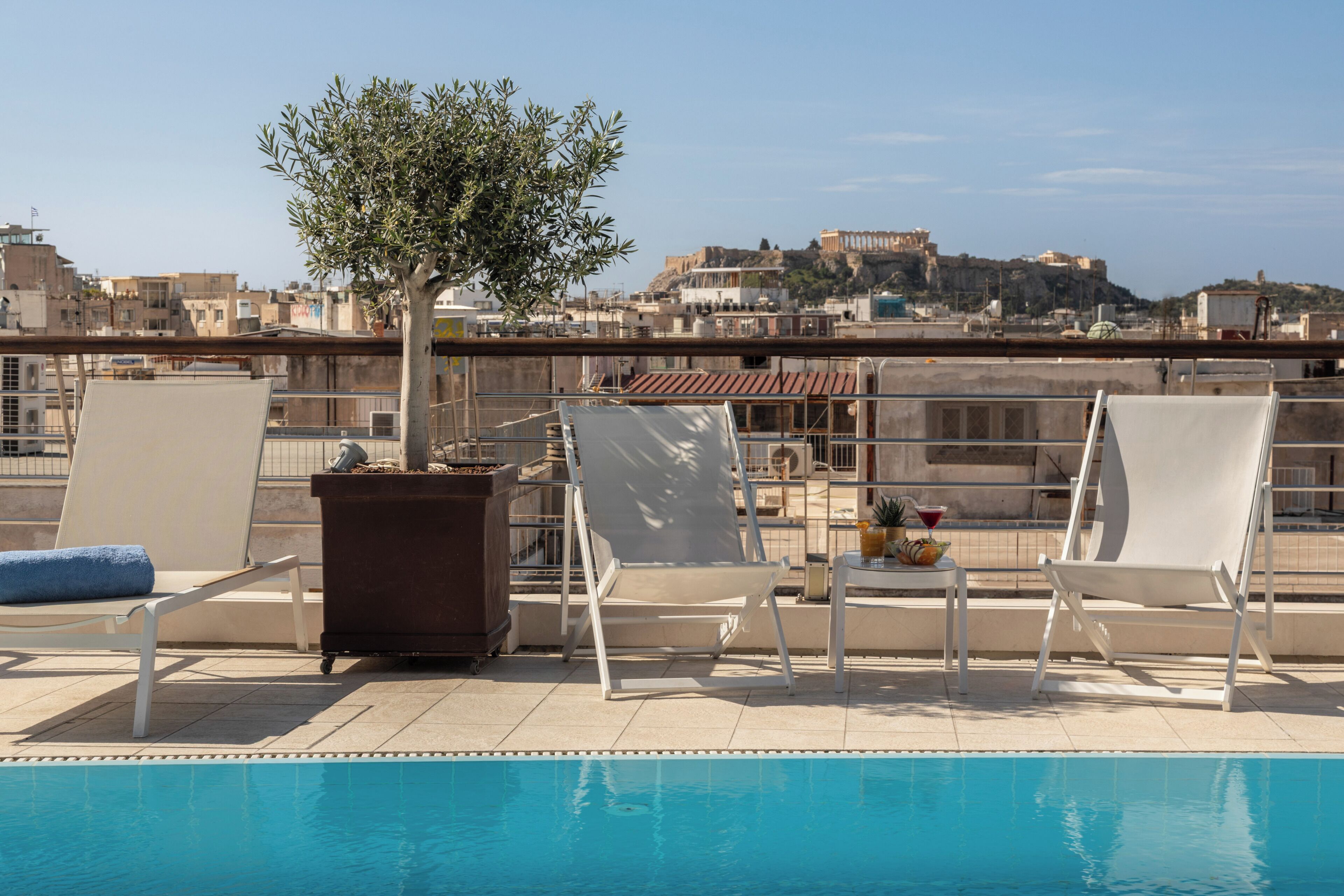 Seasonal outdoor pool, open 10 AM to 6 PM, pool umbrellas, sun loungers