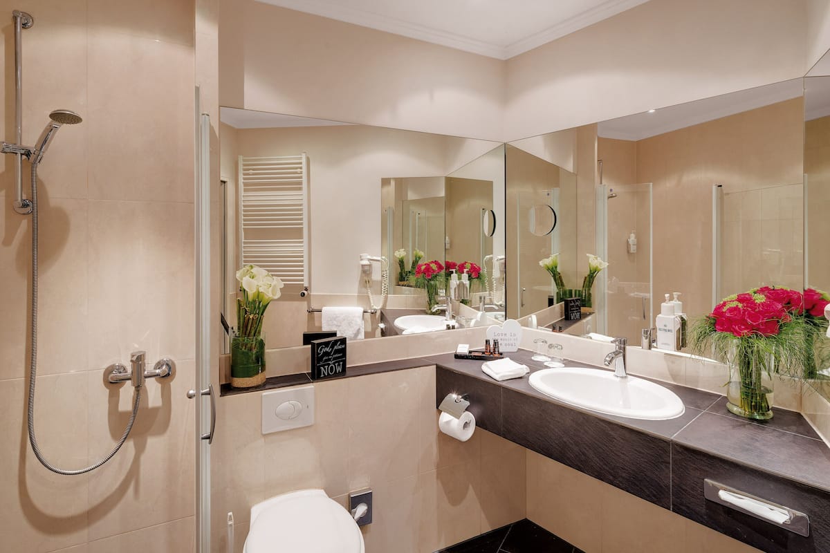 shower, hair dryer, bathrobes, towels