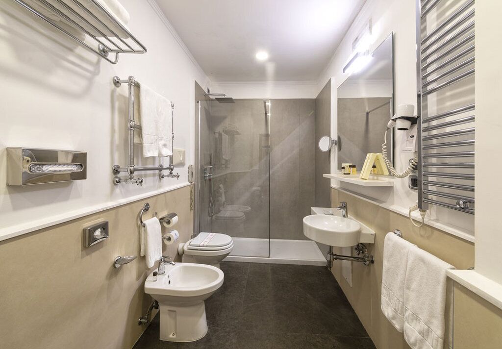 junior suite | bathroom | designer toiletries, hair dryer, bathrobes, slippers