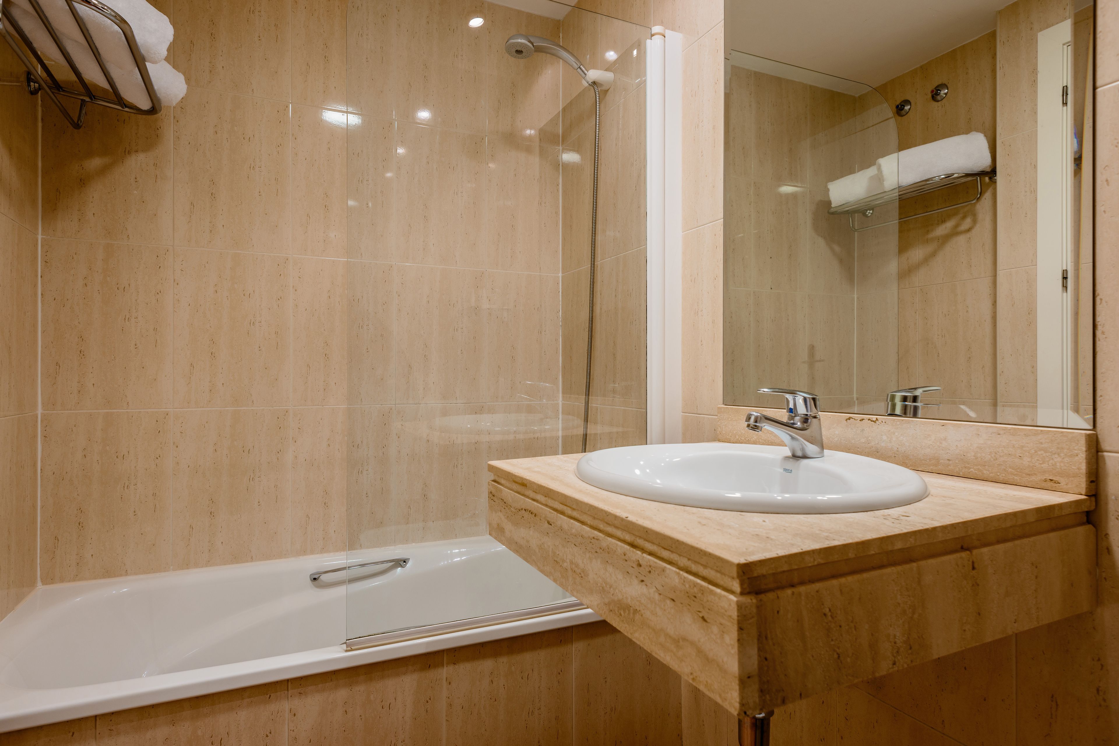 deep-soaking bathtub, eco-friendly toiletries, hair dryer, towels