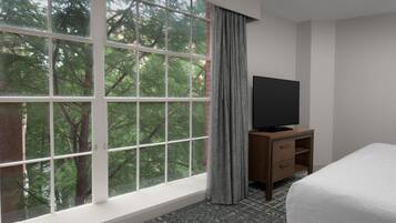 Premium bedding, desk, laptop workspace, blackout curtains