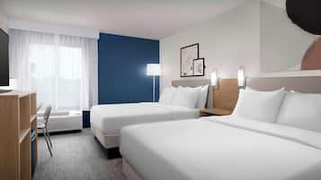 Premium bedding, desk, laptop workspace, blackout drapes