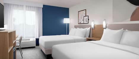 Premium bedding, desk, laptop workspace, blackout curtains