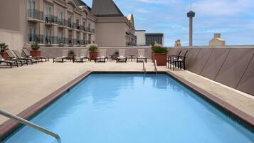 Outdoor pool, open 10:00 AM to 10:00 PM, pool loungers