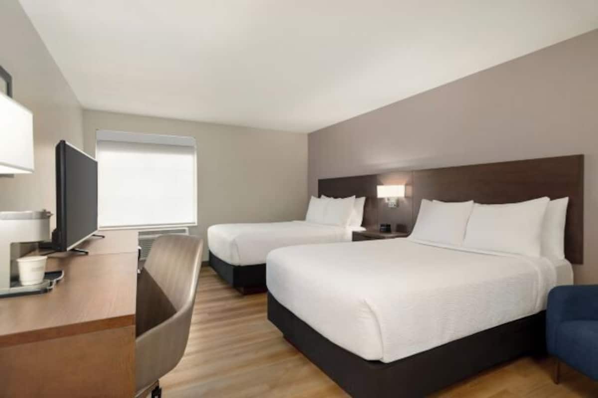 Luxe beddengoed, pillowtop-bedden, een kluis op de kamer, een bureau