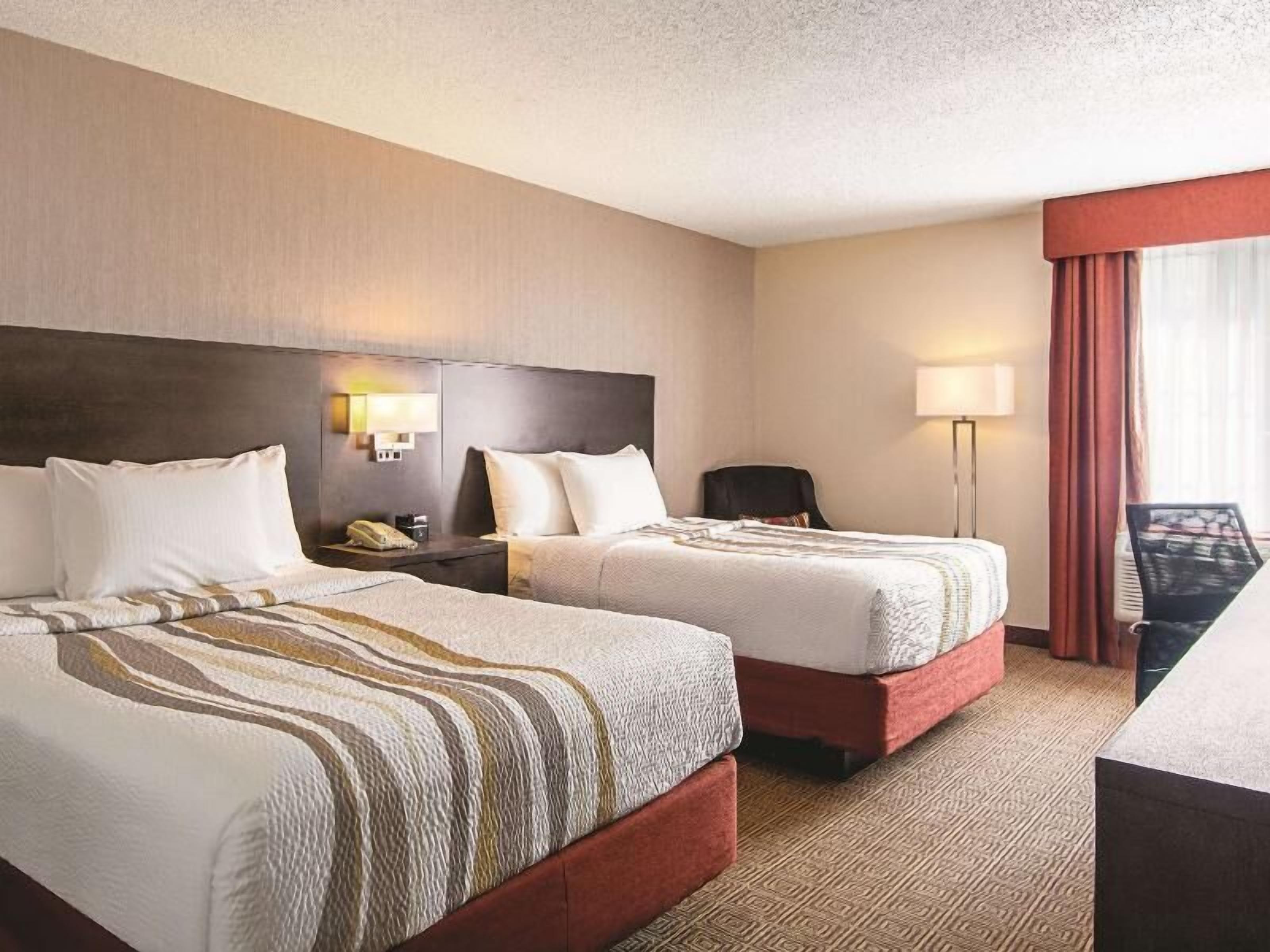 Premium bedding, pillow-top beds, in-room safe, desk
