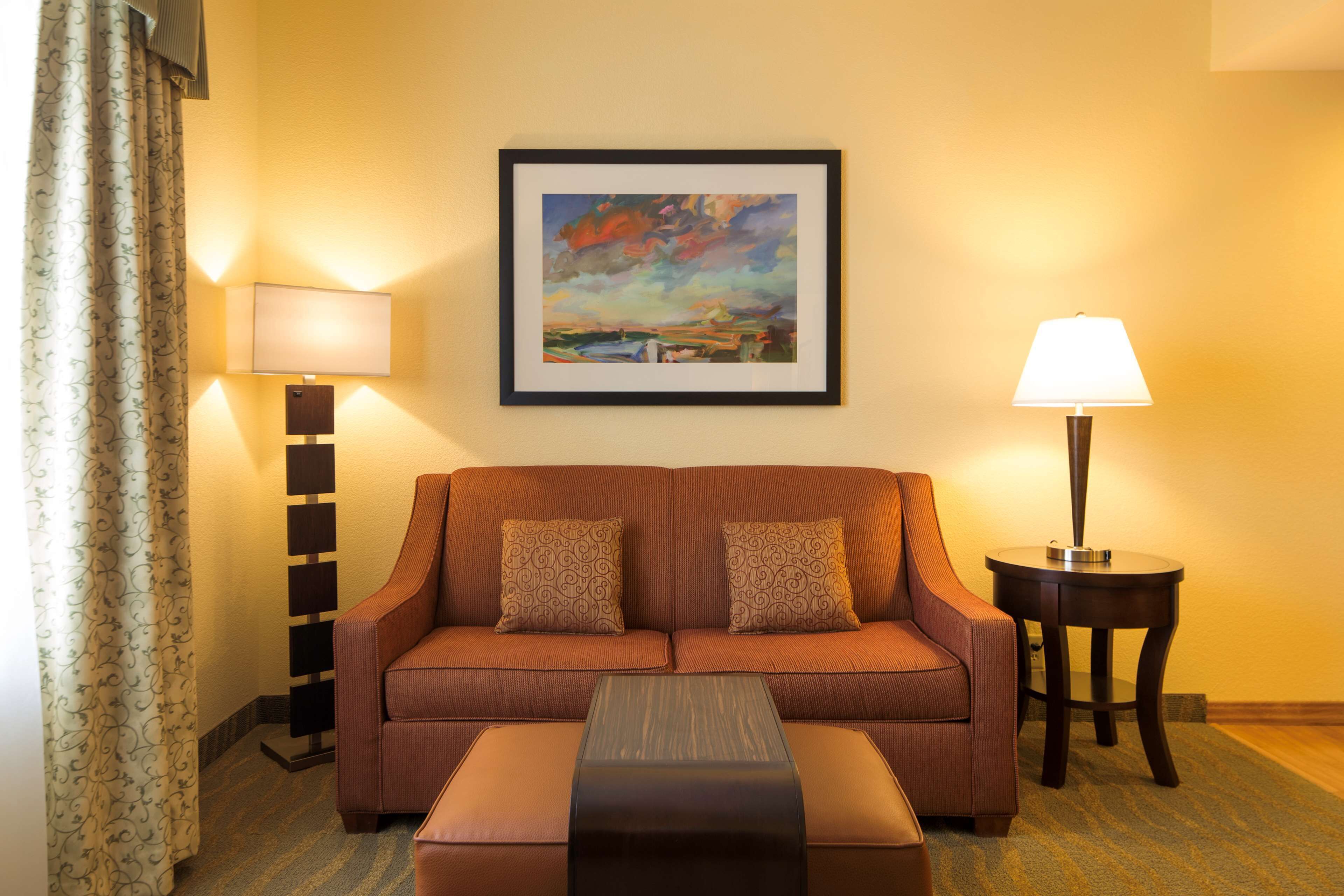 premium suite, 1 king bed, non smoking | living area | 27-inch lcd tv with cable channels, tv, mp3 dock