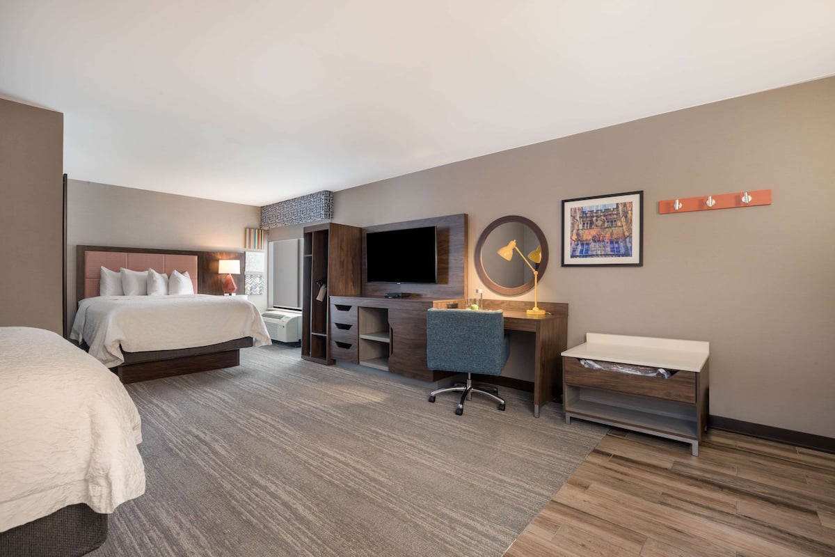 Premium bedding, desk, laptop workspace, blackout drapes