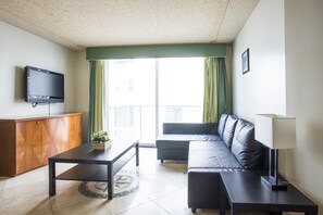 Suite, 1 habitación | Área de sala de estar | Televisión de plasma, reproductor de DVD y estación para iPod 