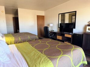 A hotel room with two beds, a desk with a television, a chair, and a microwave. - Super 8 by Wyndham Wells (Wells)