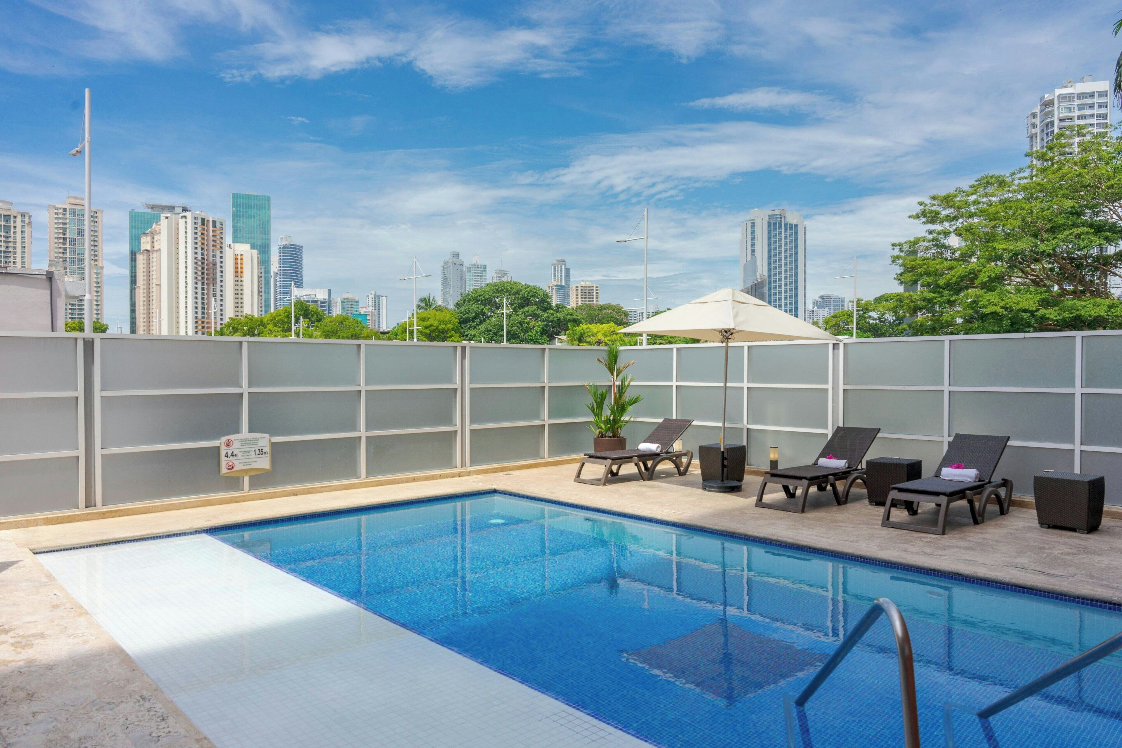 Outdoor pool, pool umbrellas, sun loungers