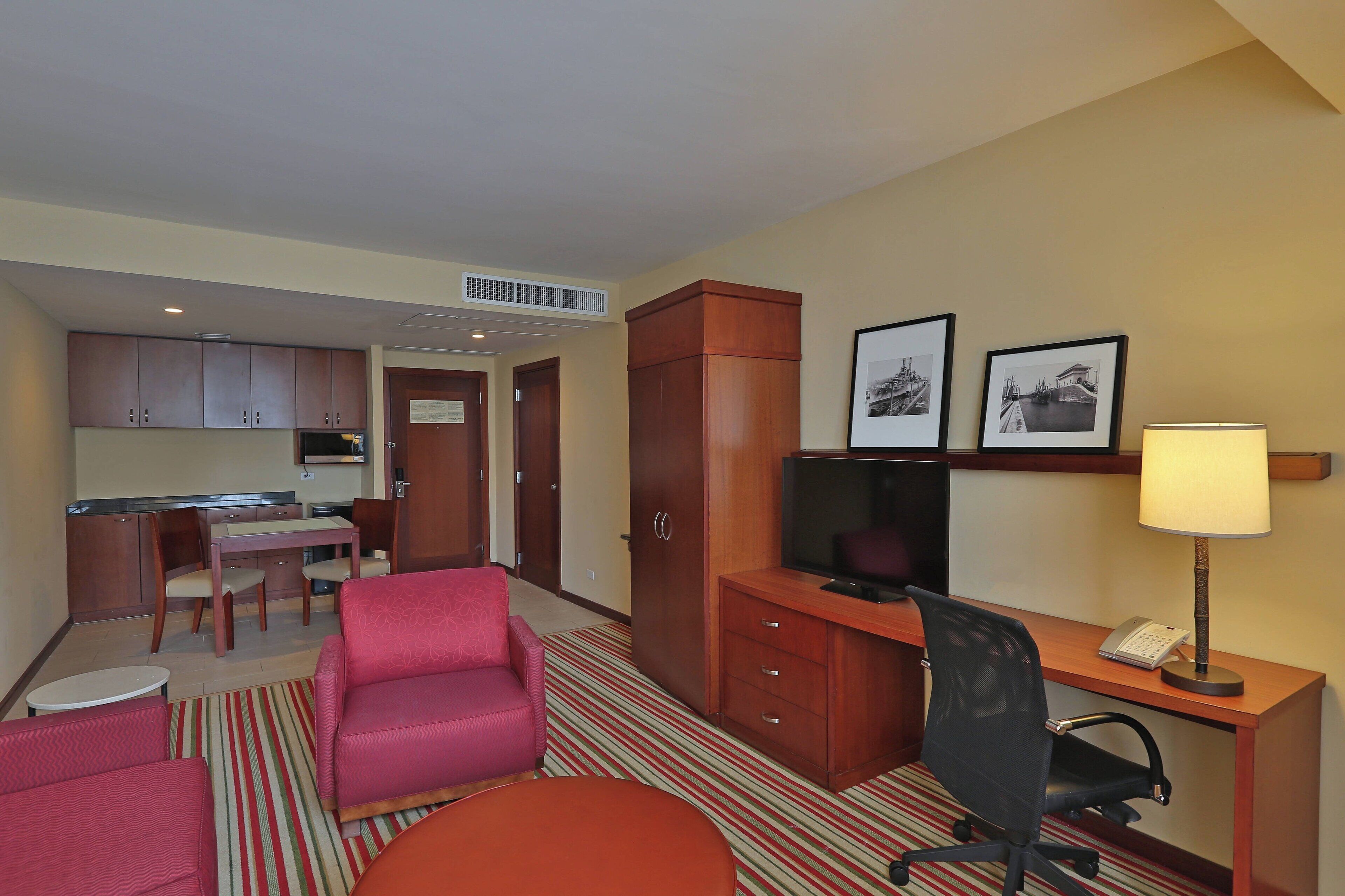 junior suite, 1 bedroom, non smoking | living room | 42-inch lcd tv with cable channels, tv, ipod dock