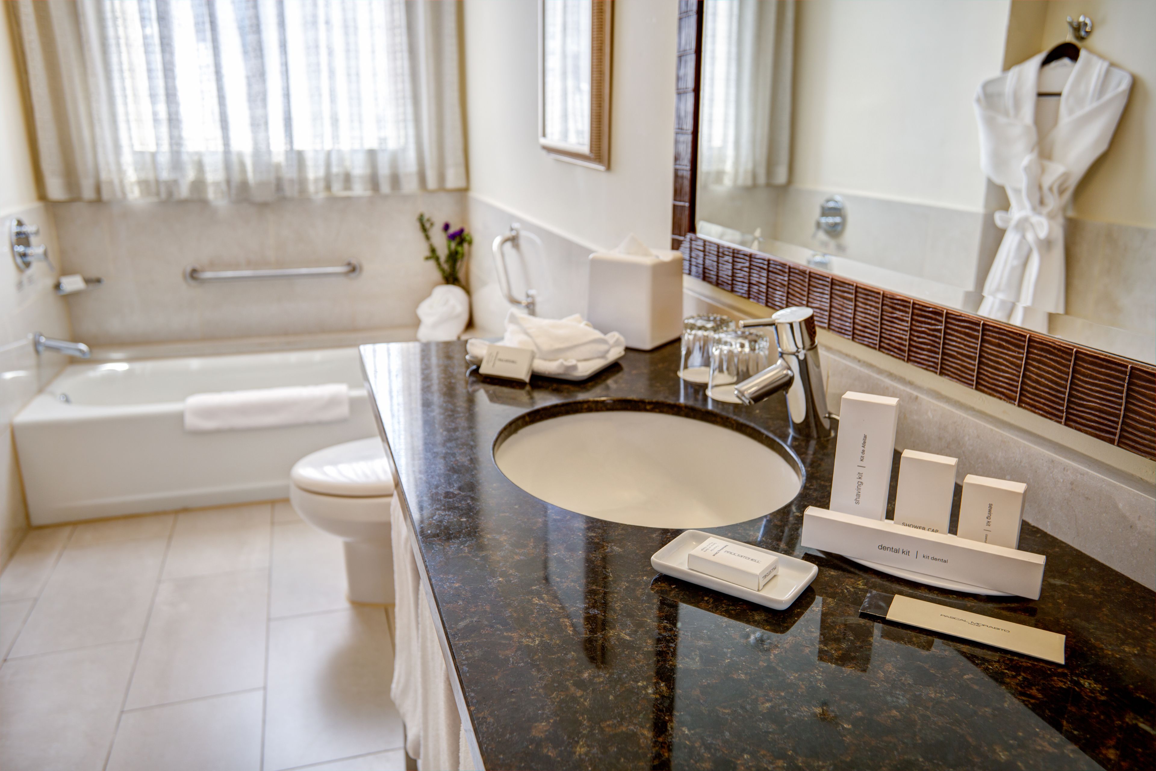 junior suite, 1 bedroom, non smoking | bathroom | combined shower/bathtub, designer toiletries, hair dryer, towels
