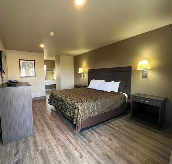 Habitación estándar, 1 cama King size | Escritorio, wifi gratis y ropa de cama 