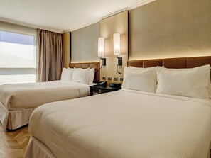 Premium bedding, down comforters, pillowtop beds, minibar
