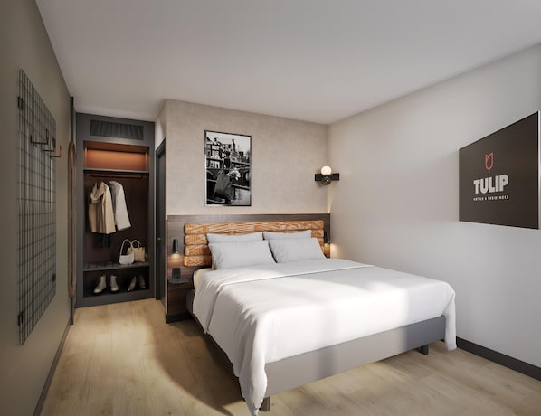 A hotel room with a bed, a wardrobe, a coat rack, a wall-mounted picture, and a sign.
