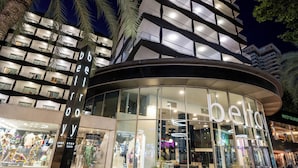 A modern building with a curved glass facade and balconies. - Climia Belroy 4* Superior Hotel (Benidorm)