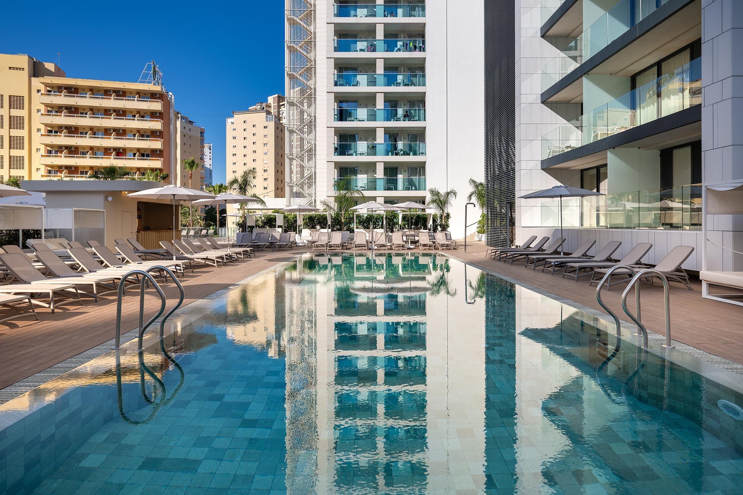 Outdoor pool, open 9:00 AM to 8:00 PM, pool umbrellas, pool loungers