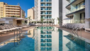 Outdoor pool, open 9:00 AM to 8:00 PM, pool umbrellas, pool loungers