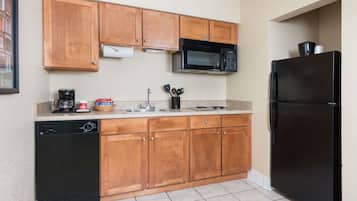Fridge, microwave, coffee/tea maker, cookware/dishes/utensils
