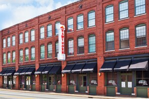A red brick building with awnings and signage for "SEVANT HILLS."