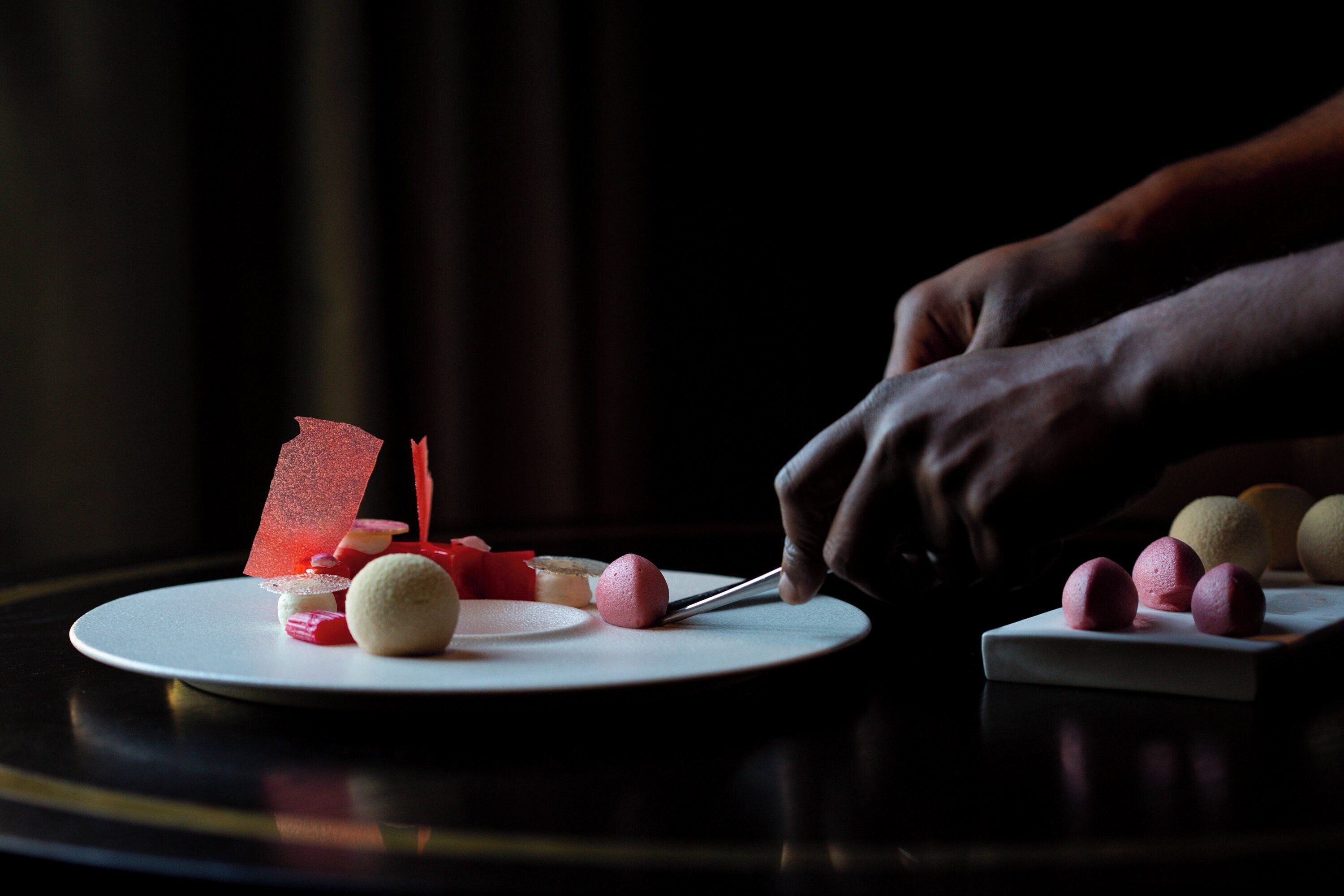 A dessert plate with various sweets and a knife.