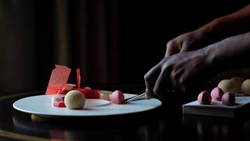 A dessert plate with various sweets and a knife.