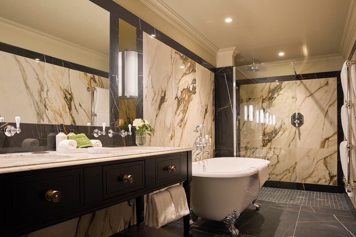 garden suite | bathroom | designer toiletries, hair dryer, bathrobes, slippers