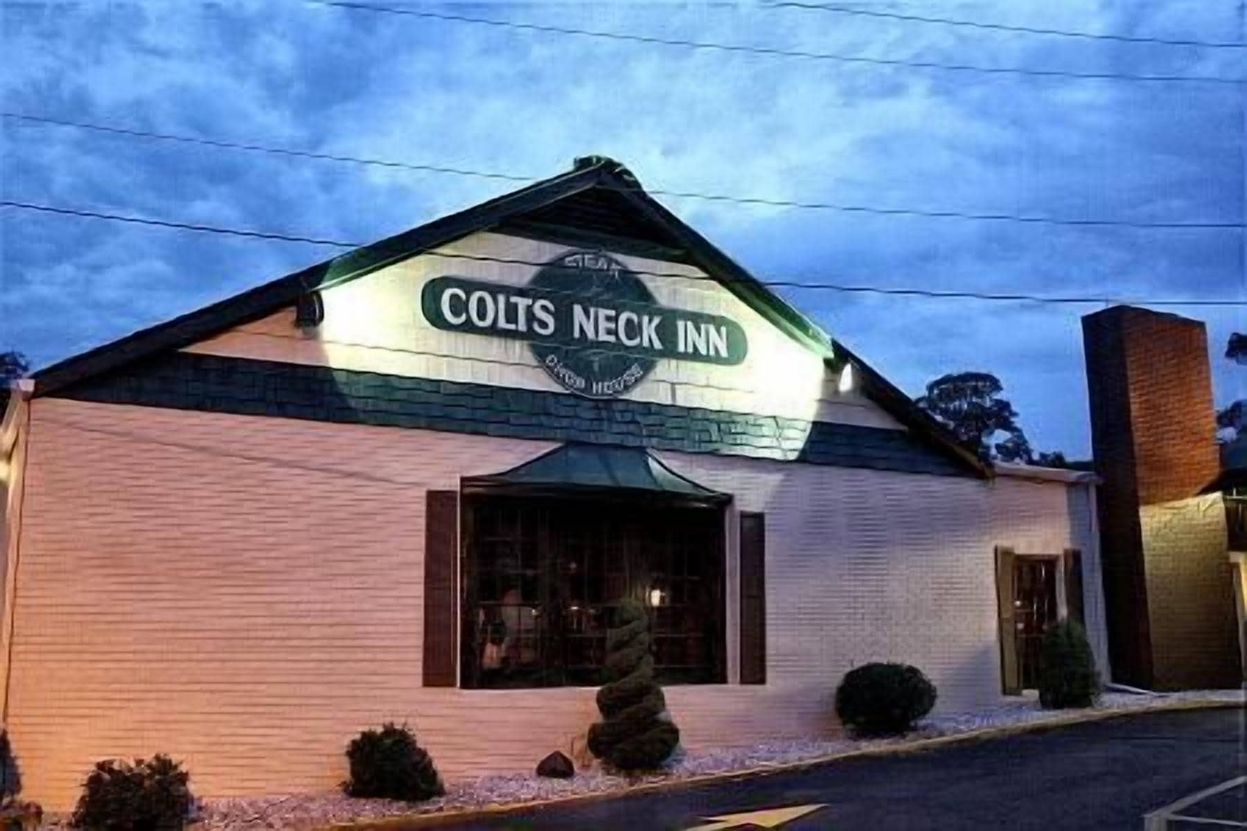 A building with a sign reading "Colts Neck Inn."