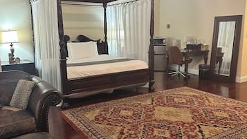 Luxury Suite, 1 Bedroom, Jetted Tub | Living area | 32-inch TV with cable channels